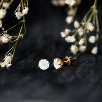 Rosec Jewels 6mm moonstone solitaire stud earrings featuring elegant decorative design and polished silver setting.