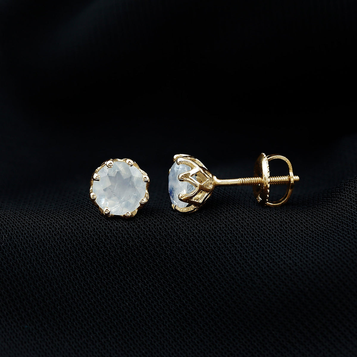 Six millimeter moonstone solitaire stud earrings by Rosec Jewels, featuring elegant and sparkling gemstone settings.