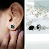 Rosec Jewels 2 Carat oval cut black onyx stud earrings with moissanite halo, elegant jewelry for pierced ears.