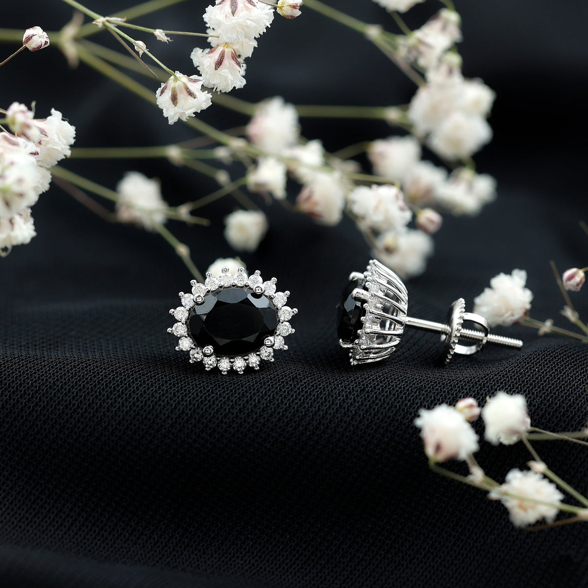 Oval cut black onyx stud earrings with moissanite halo, featuring a sleek design from Rosec Jewels.