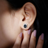 Oval cut black onyx stud earrings with a moissanite halo, featuring a rose gold finish from Rosec Jewels.