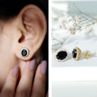 Oval cut black onyx stud earrings with moissanite halo from Rosec Jewels, showcasing elegant black gemstone and sparkling accents.