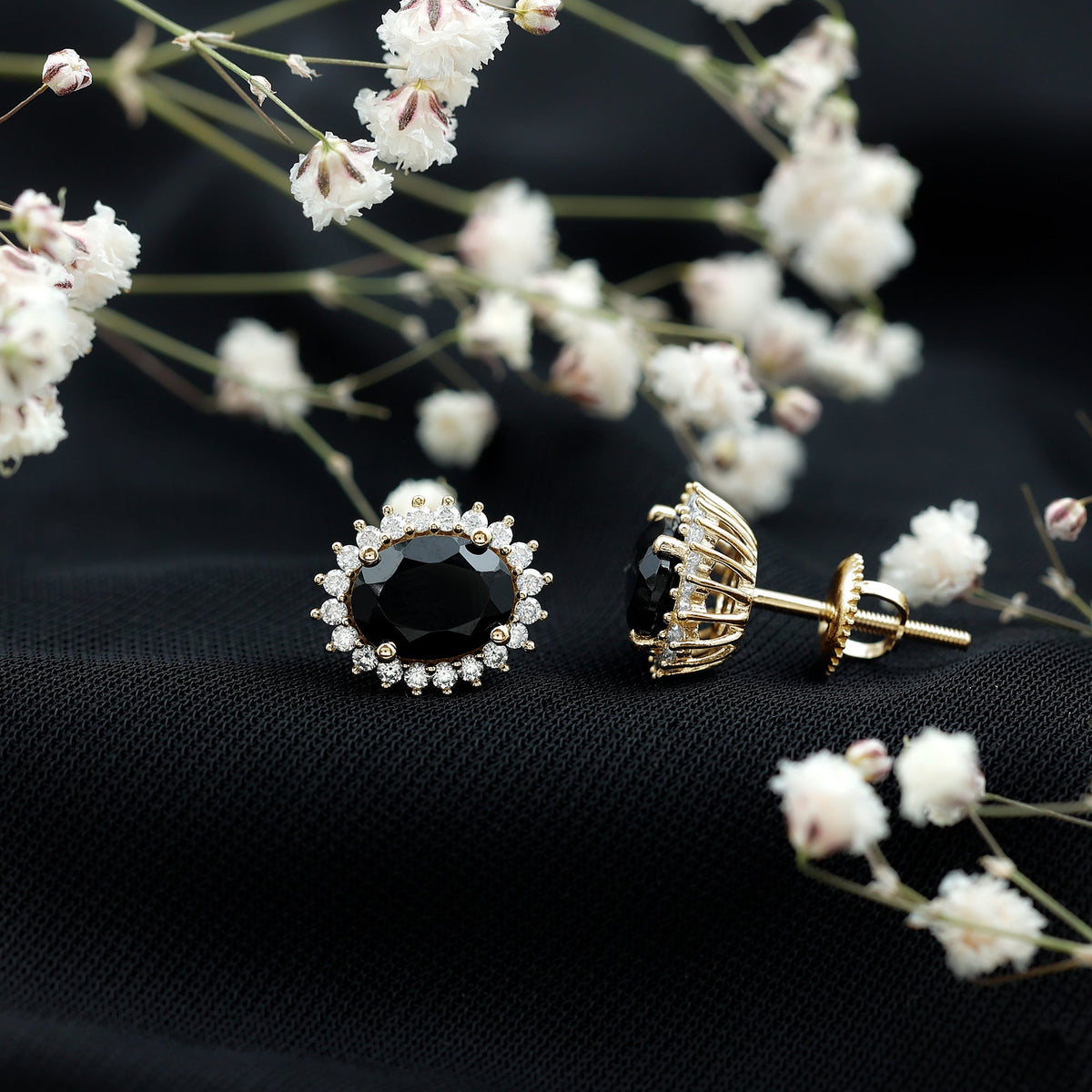 Oval cut black onyx stud earrings with moissanite halo, featuring elegant silver setting from Rosec Jewels.