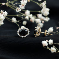 Oval cut black onyx stud earrings with moissanite halo, featuring elegant silver setting from Rosec Jewels.