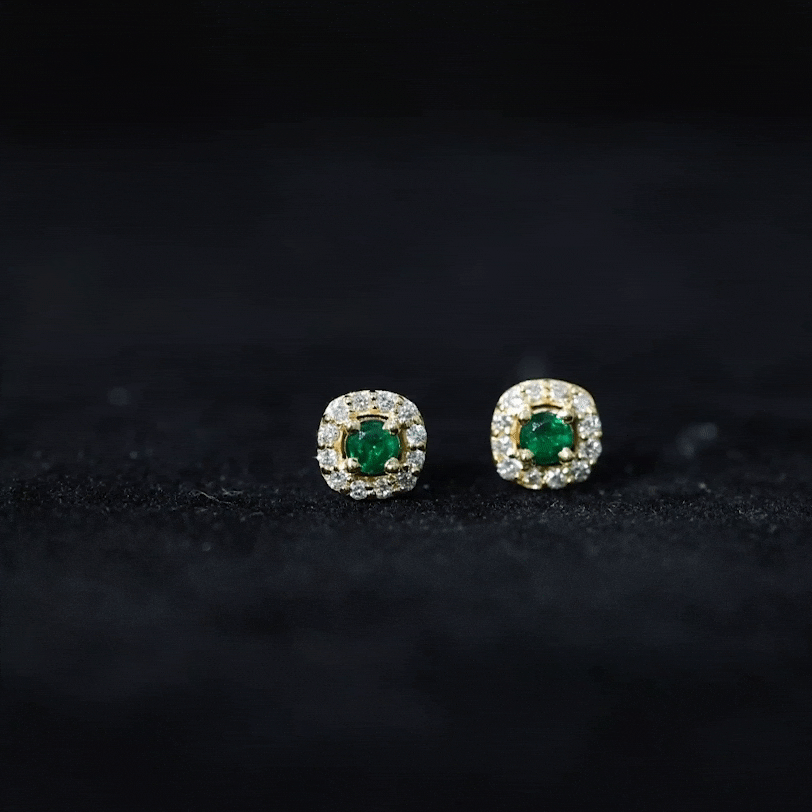 Elegant minimalist emerald and diamond halo stud earrings by Rosec Jewels, featuring green gemstones and sparkling accents.
