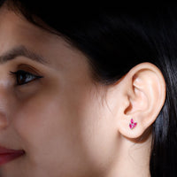 Rosec Jewels marquise-shaped ruby leaf stud earrings for women, featuring vibrant red rubies in a leaf design.