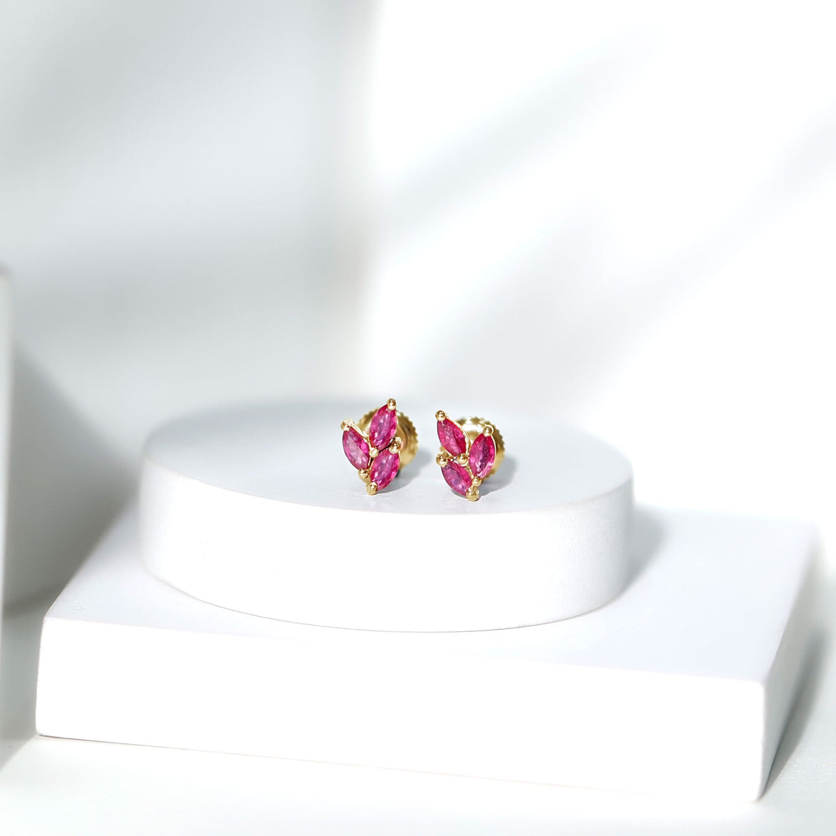 Certified marquise shape ruby leaf stud earrings for women by Rosec Jewels, featuring elegant ruby leaves on sterling silver posts.