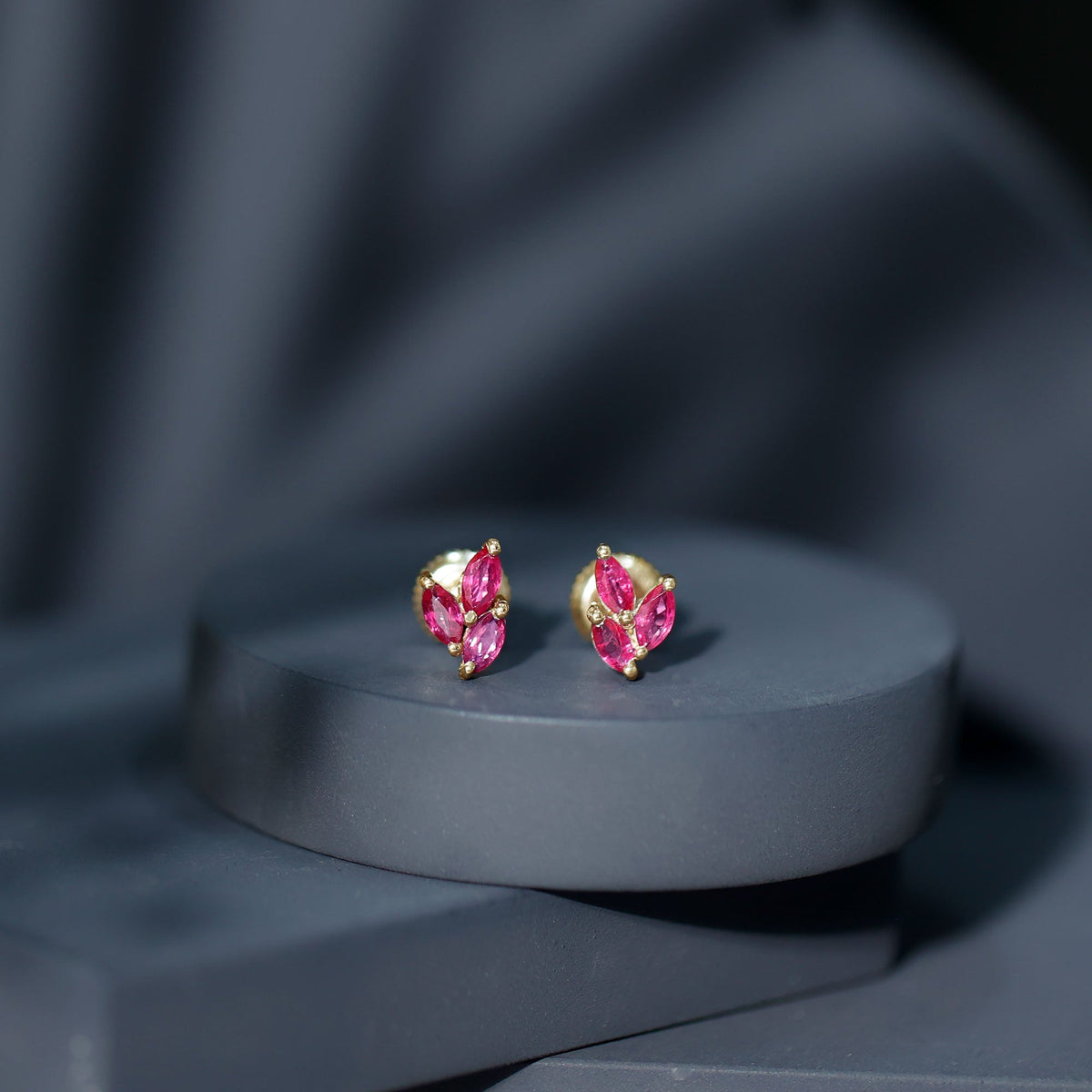 Certified marquise-shaped ruby leaf stud earrings for women by Rosec Jewels, featuring vibrant red gemstone design.