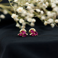 Marquise shape ruby leaf stud earrings for women by Rosec Jewels, featuring vibrant red rubies and delicate leaf design.