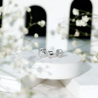 Certified 0.6 Carat Moissanite Stud Earrings in Bezel Setting