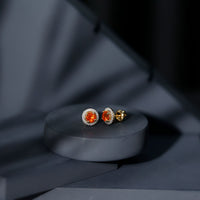 Natural orange fire opal stud earrings with diamonds from Rosec Jewels, showcasing vibrant gemstones set in elegant earrings.