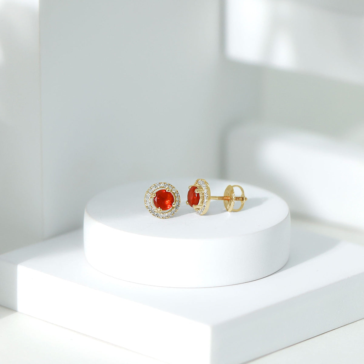 Natural orange fire opal stud earrings with sparkling diamonds by Rosec Jewels, showcasing vibrant gemstone and elegant design.