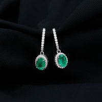 Oval shape emerald hoop drop earrings with diamond halo featuring green gemstones and sparkling accents by Rosec Jewels