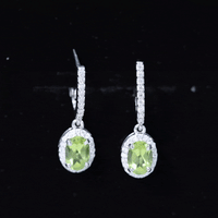 Yellow 2-carat claw set peridot and moissanite drop hoop earrings by Rosec Jewels, featuring vibrant gemstones and elegant design.