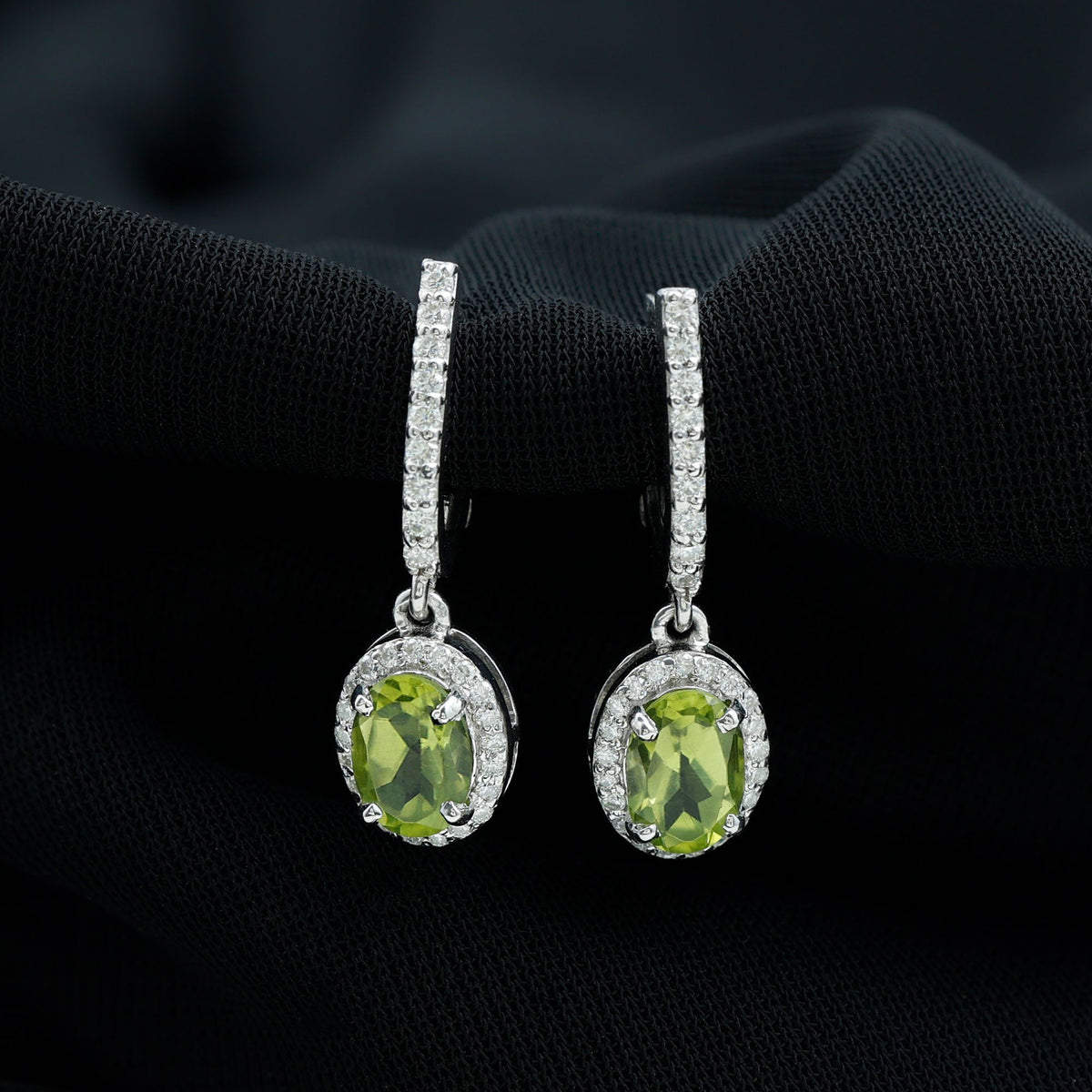 Rosec Jewels 2 Carat Claw Set Peridot and Moissanite Drop Hoop Earrings showing gold hoops with vibrant green peridot and sparkling moissanite stones