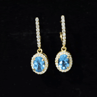 Oval London Blue Topaz and diamond hoop drop earrings by Rosec Jewels featuring 2.2 carats in a stylish earring design.