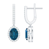 Oval London Blue Topaz and diamond hoop drop earrings by Rosec Jewels featuring 2.2 carats of gemstones and elegant design.