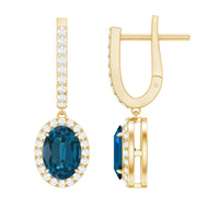 Oval London Blue Topaz and diamond hoop drop earrings by Rosec Jewels featuring 2.2 carats of blue topaz and sparkling diamonds.