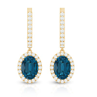 Oval London Blue Topaz and diamond hoop drop earrings by Rosec Jewels featuring 2.2 carats of gemstones and elegant design.
