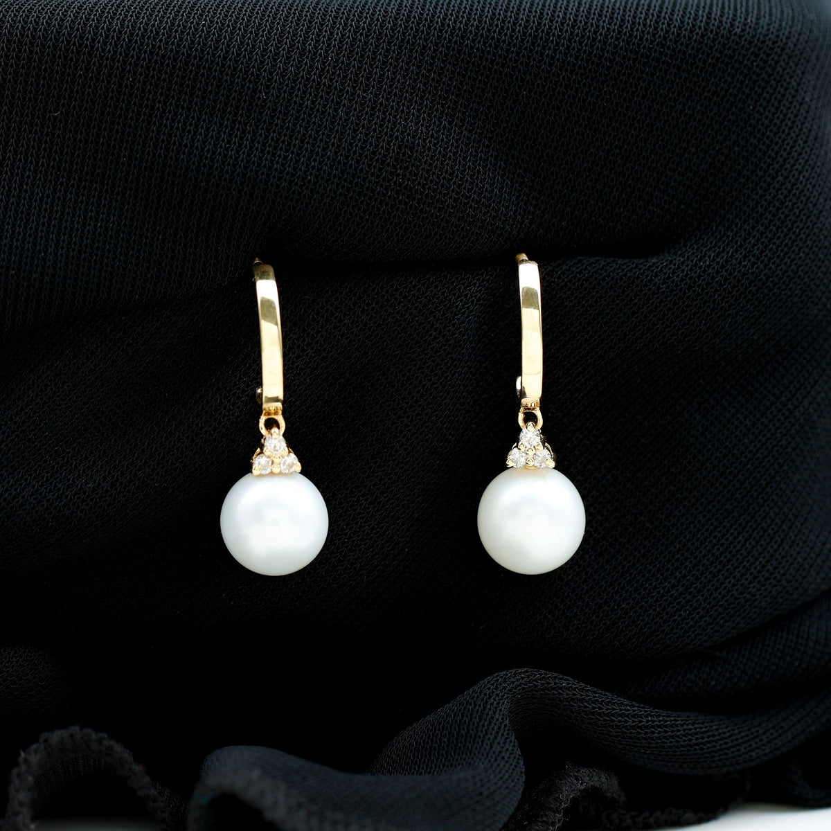 Round freshwater pearl and diamond hoop drop earrings by Rosec Jewels featuring elegant pearl and sparkling diamond accents.