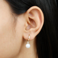 Round freshwater pearl and diamond hoop drop earrings by Rosec Jewels featuring elegant gold hoops with sparkling pearls and diamonds.