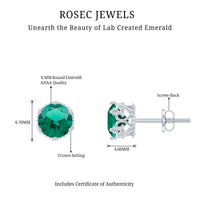 Lab-created emerald solitaire stud earrings in a crown setting by Rosec Jewels, featuring vibrant green gemstones.