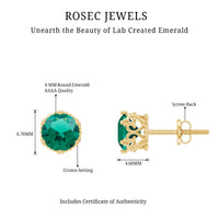 Lab-created emerald solitaire stud earrings in a crown setting by Rosec Jewels, featuring vibrant green emeralds and elegant metalwork.
