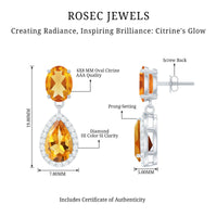Natural 2 carat citrine and diamond teardrop earrings with gold settings, showcasing elegant jewelry design.