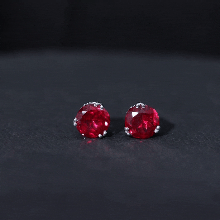 Rosec Jewels 4.7 carat lab-grown ruby stud earrings for women with round cut rubies and silver settings, elegant and sparkling.