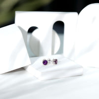 Natural amethyst and diamond bridal stud earrings by Rosec Jewels featuring purple gemstones and sparkling accents.