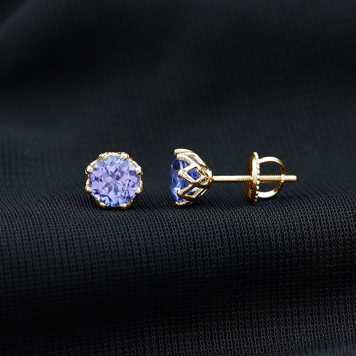 Rosec Jewels 1 Carat Tanzanite stud earrings featuring vibrant blue-purple gemstones set in silver.
