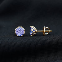 Rosec Jewels 1 Carat Tanzanite stud earrings featuring vibrant blue-purple gemstones set in silver.