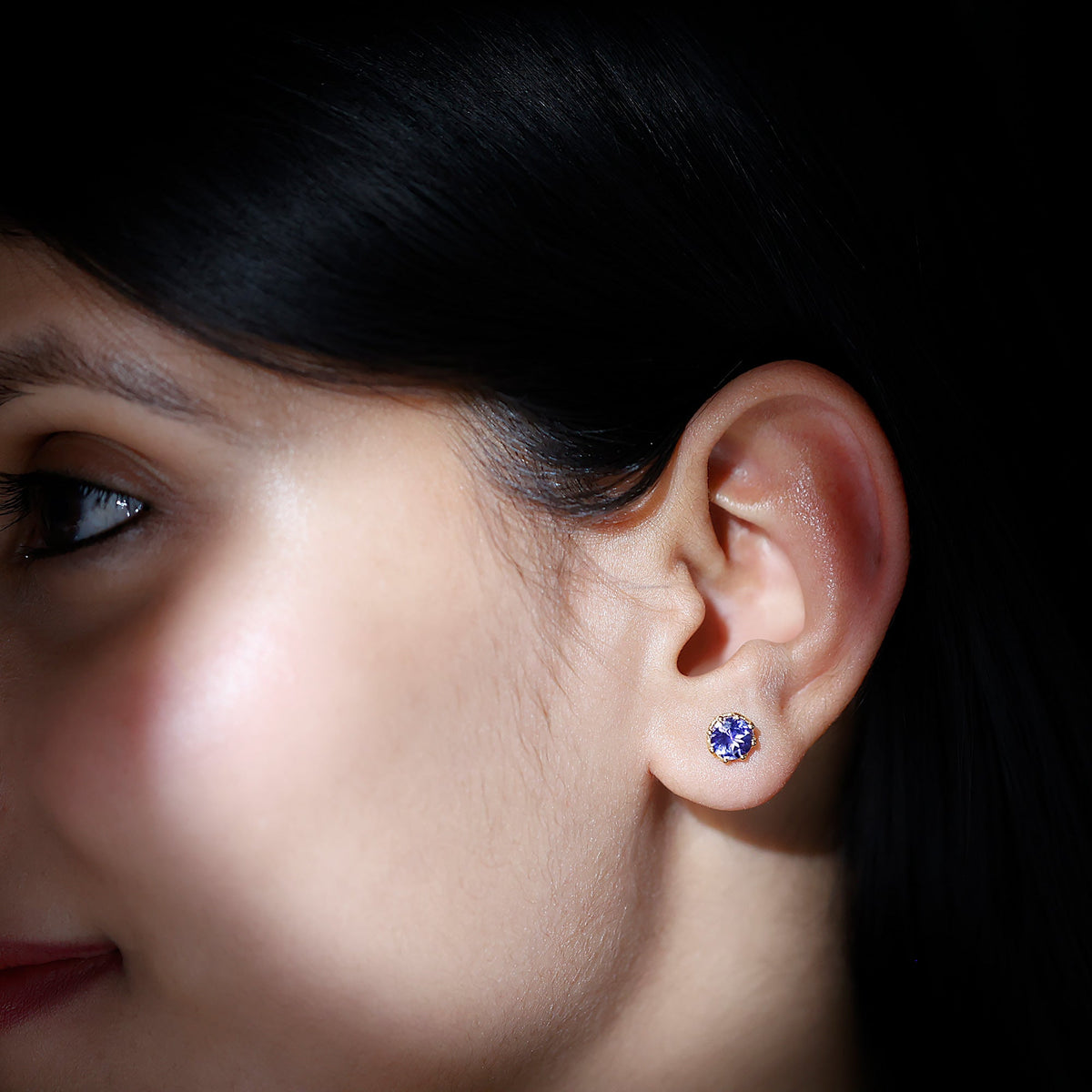 Rosec Jewels 1 Carat Tanzanite Stud Earrings featuring vibrant blue-purple gemstones and classic silver settings.