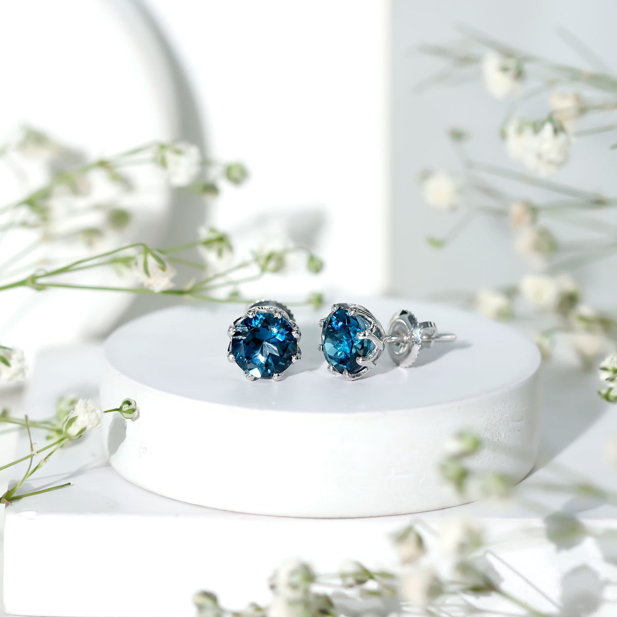 Rosec Jewels 2.7 Carat London Blue Topaz solitaire stud earrings with certificate, featuring vibrant blue gemstones and classic design.