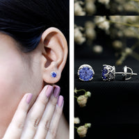 Created blue sapphire solitaire crown stud earrings by Rosec Jewels featuring 2-carat blue sapphires and elegant crown design.