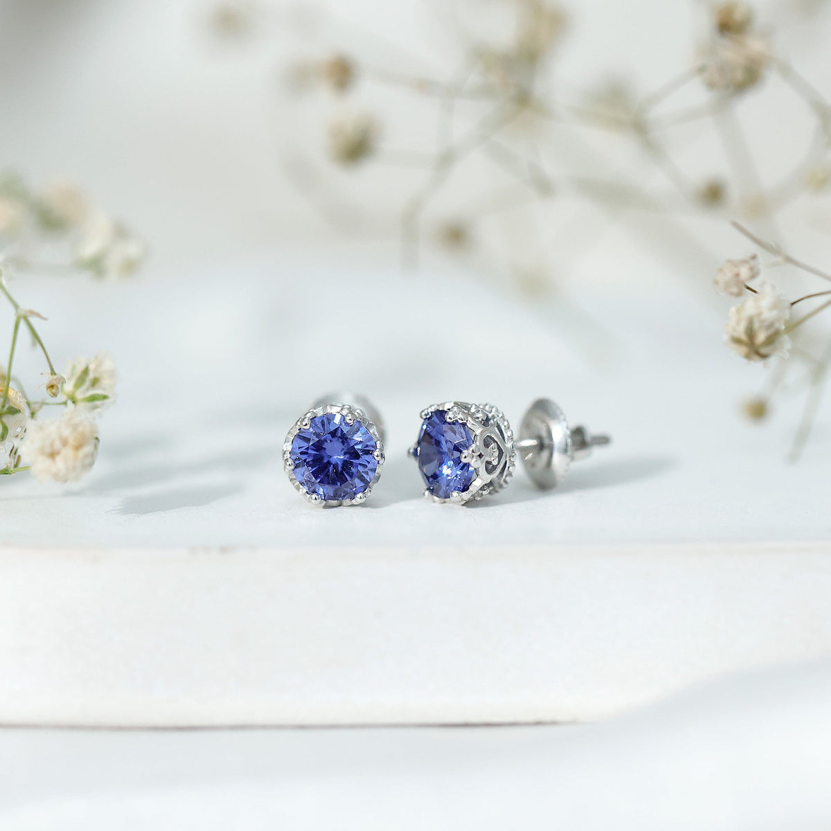 Rosec Jewels 2 CT created blue sapphire solitaire crown stud earrings, showcasing elegant blue sapphires in a classic design.