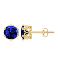 Created blue sapphire solitaire crown stud earrings by Rosec Jewels featuring two carat blue sapphires on elegant earrings.