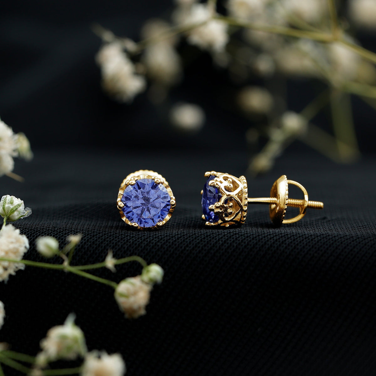 Blue sapphire solitaire crown stud earrings by Rosec Jewels, showcasing 2-carat created sapphires set in elegant earring design.