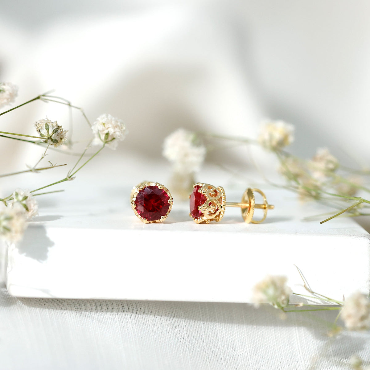 Lab-created ruby solitaire stud earrings by Rosec Jewels featuring 2.7 carats of vibrant red rubies in classic earrings design.