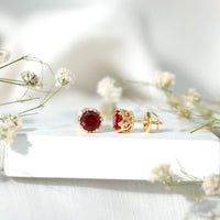 Lab-created ruby solitaire stud earrings by Rosec Jewels featuring 2.7 carats of vibrant red rubies in classic earrings design.