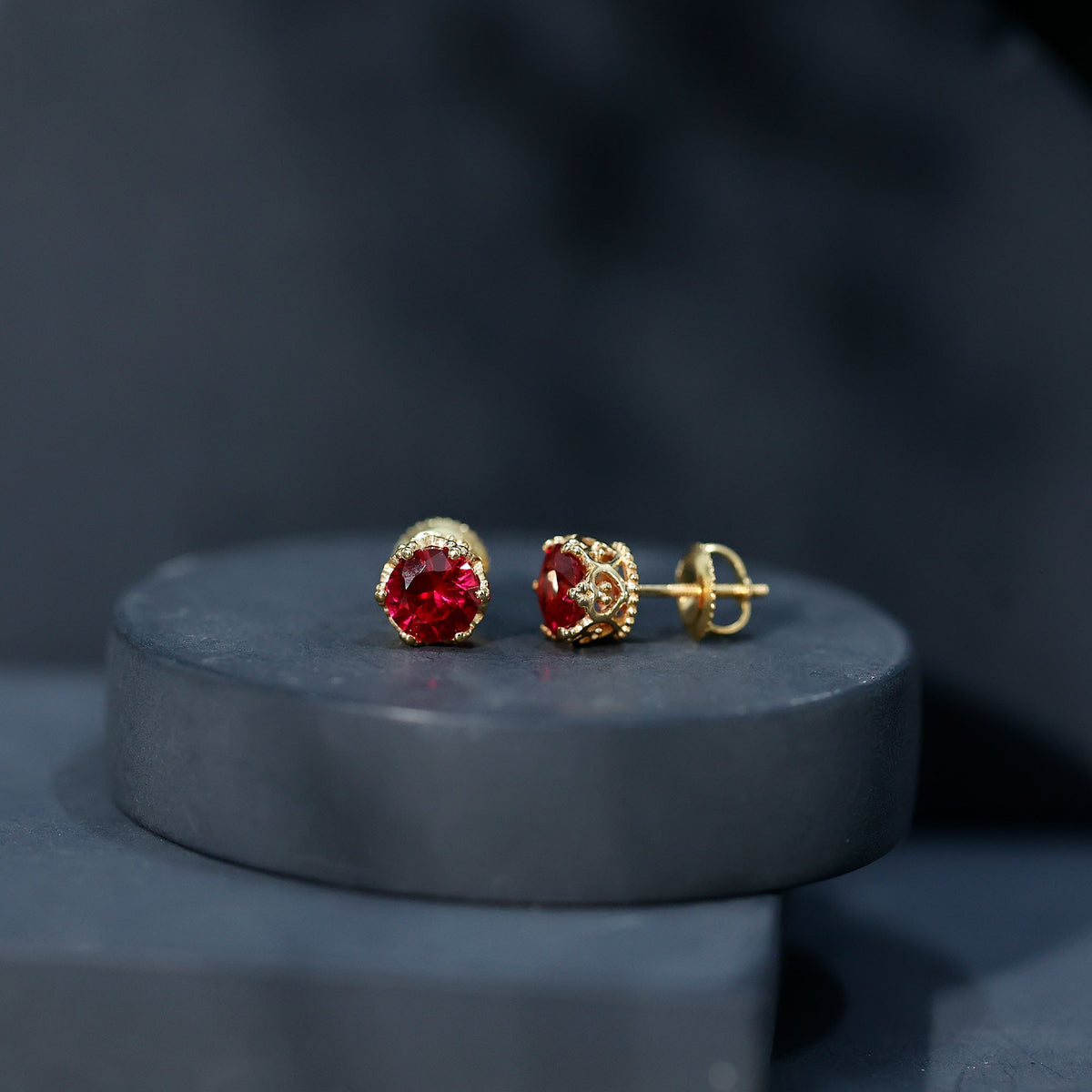 Lab-created ruby solitaire stud earrings by Rosec Jewels featuring 2.7 carat round-cut rubies in a classic earring setting.