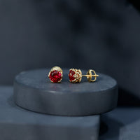Lab-created ruby solitaire stud earrings by Rosec Jewels featuring 2.7 carat round-cut rubies in a classic earring setting.