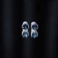Round cut London Blue Topaz crown stud earrings by Rosec Jewels featuring 2.7 carat blue gemstone in a classic stud design.
