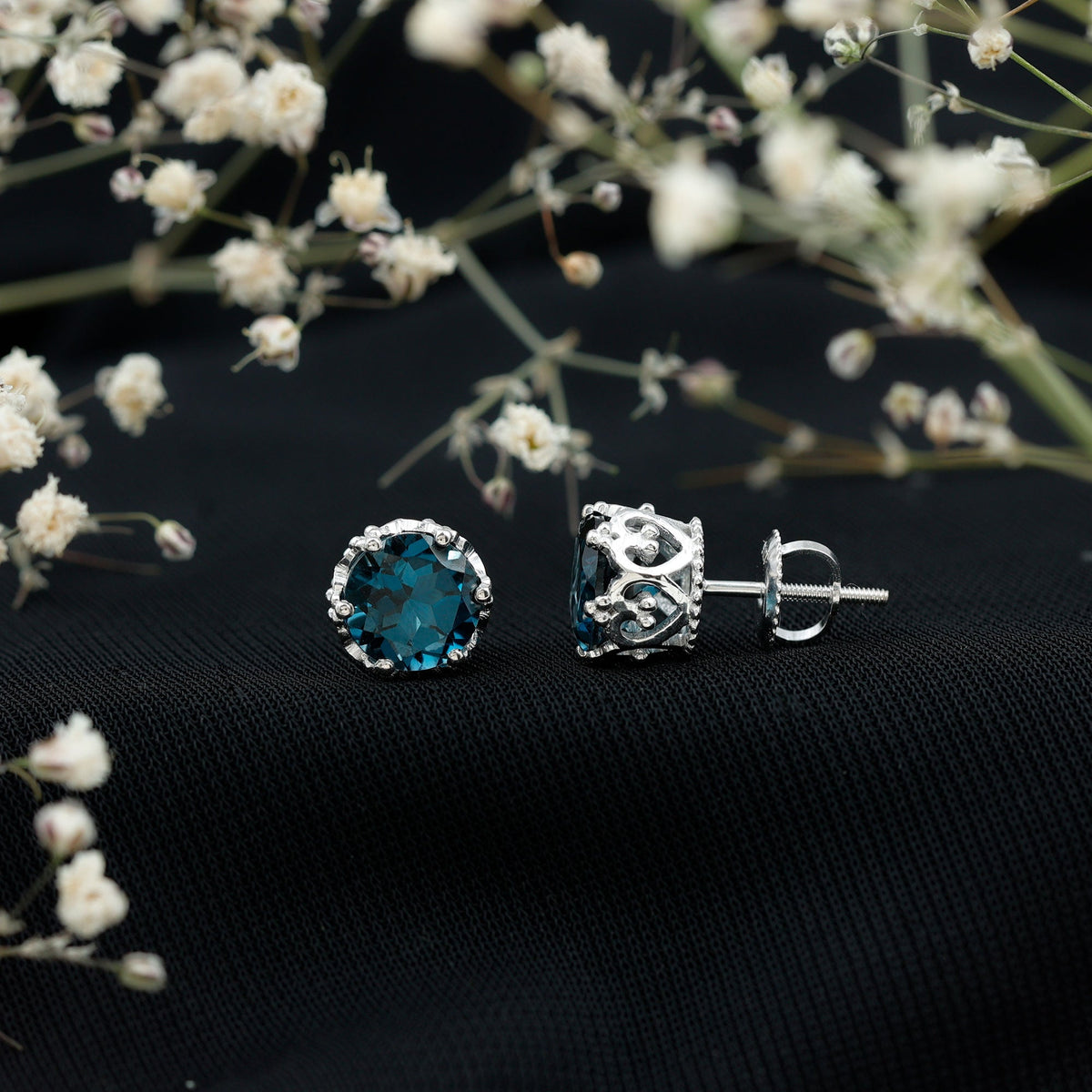Round cut London Blue Topaz crown stud earrings by Rosec Jewels featuring 2.7 carats of vibrant blue gemstones.