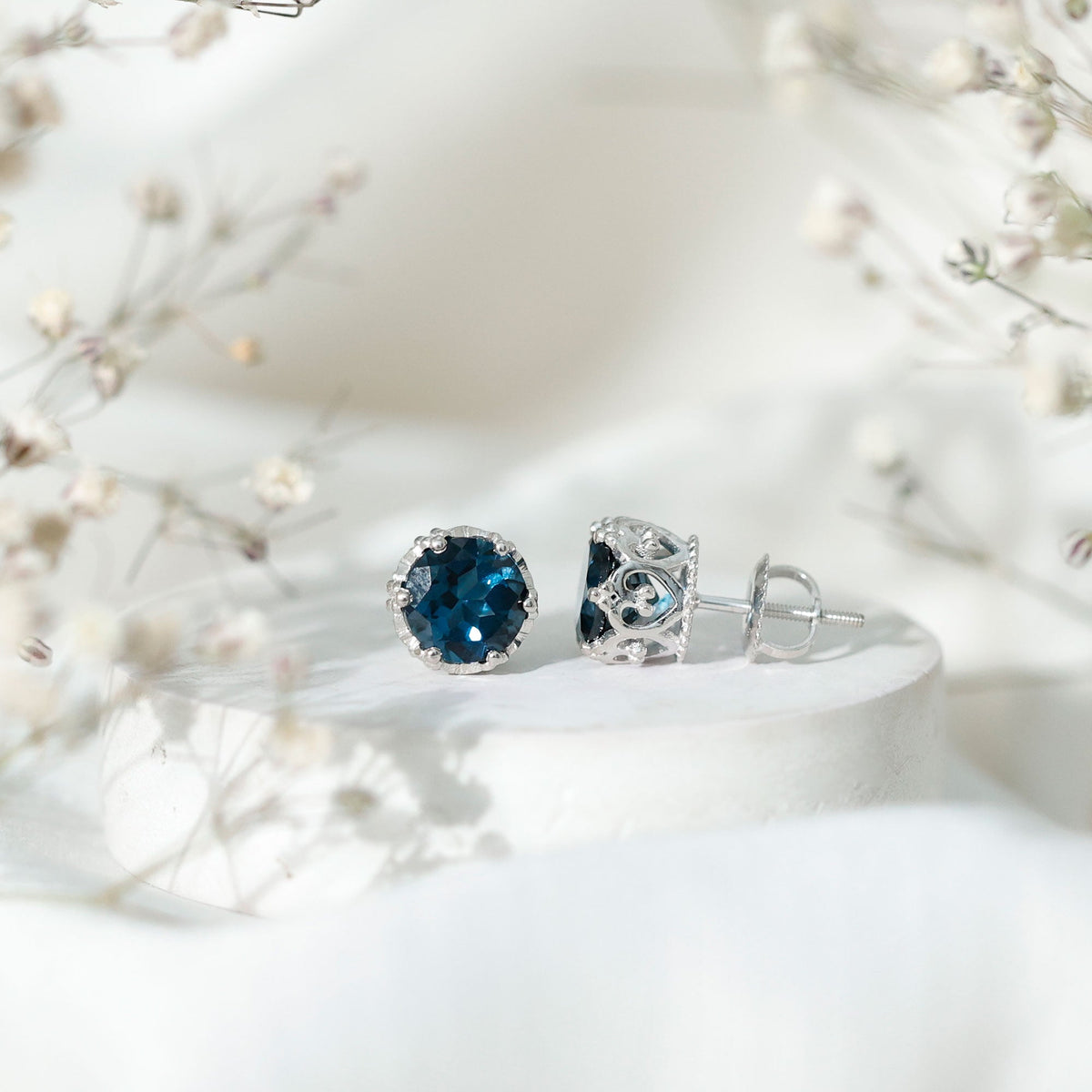 Rosec Jewels 2.7 carat round cut London Blue Topaz crown stud earrings on a white background