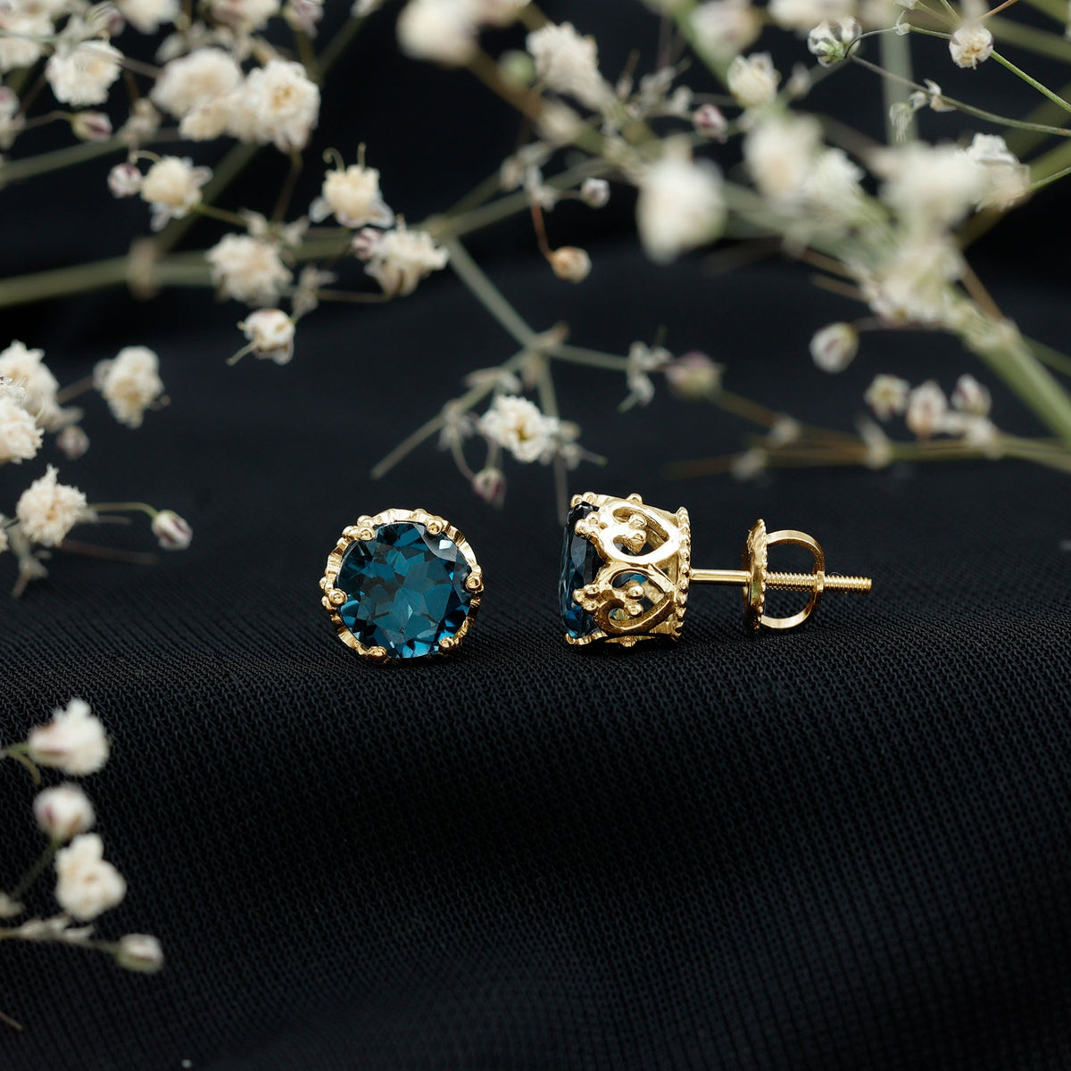 Round cut London Blue Topaz crown stud earrings by Rosec Jewels featuring 2.7 carats of vibrant blue gemstone.