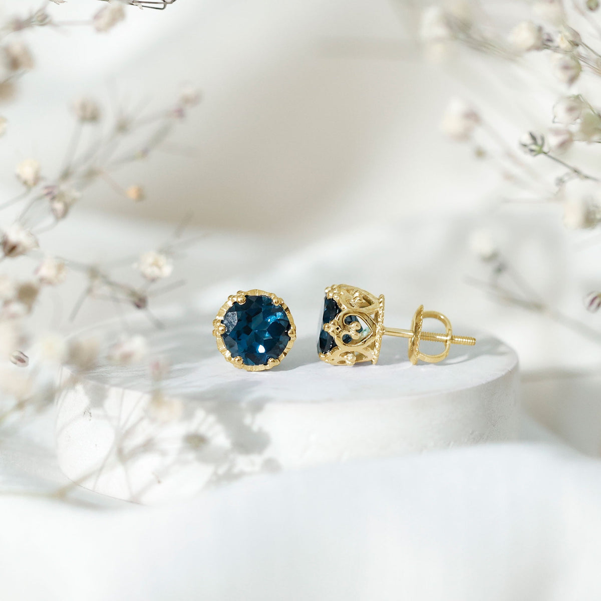 Round cut London Blue Topaz crown stud earrings by Rosec Jewels, featuring 2.7 carats of vibrant blue gemstones.