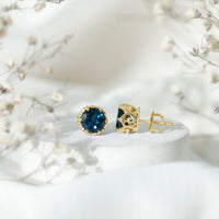 Round cut London Blue Topaz crown stud earrings by Rosec Jewels, featuring 2.7 carats of vibrant blue gemstones.