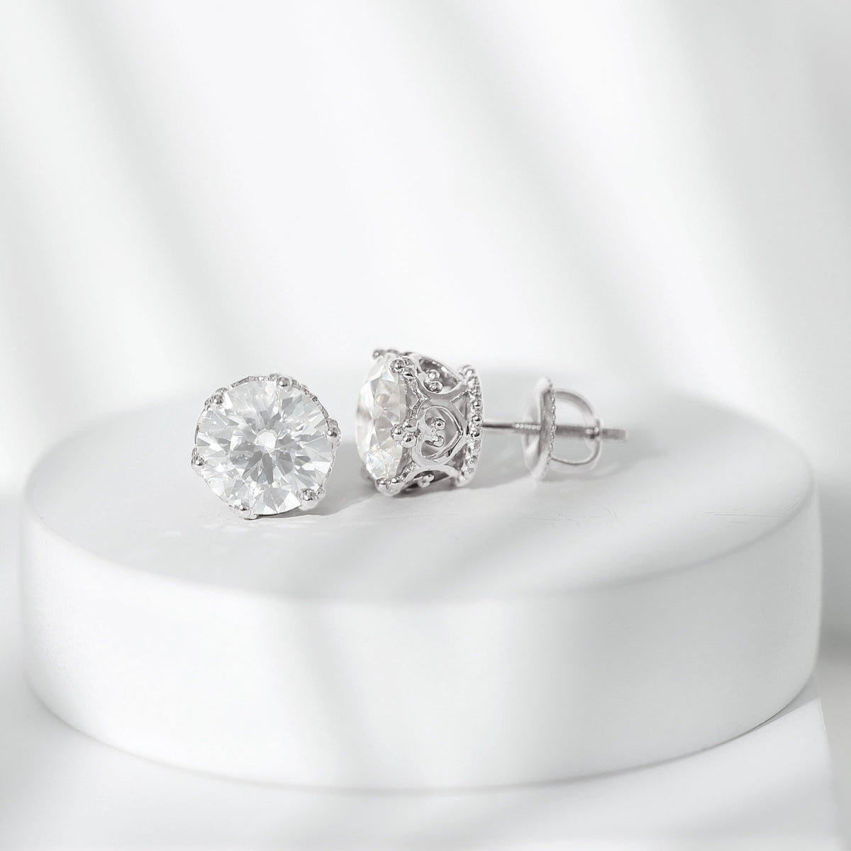 Round 1.97 Carat Moissanite stud earrings in crown setting by Rosec Jewels, showcasing sparkling gemstone and elegant design.