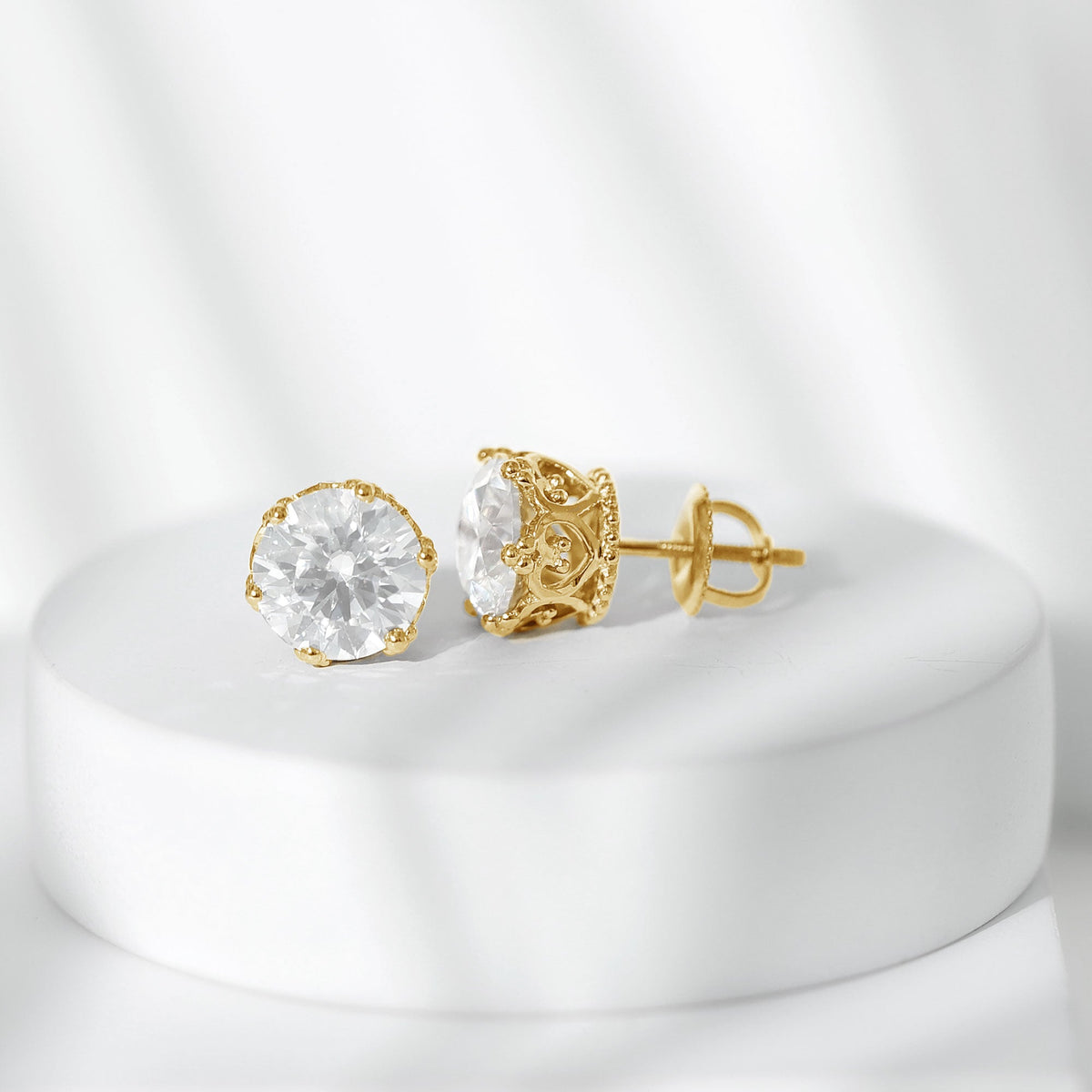 Round 1.97 carat Moissanite stud earrings in crown setting by Rosec Jewels, showcasing sparkling gemstone and elegant design.